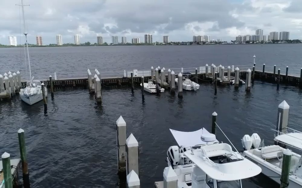 An aerial view of a South Florida marina, its docks, pilings and moored boats